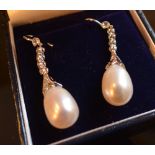A Pair of 18ct. White Gold Pearl and Rose Cut Diamond Drop Earrings, the pearl 7.