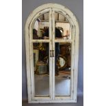 An Arch Framed Cream Painted Wall Mirror in the form of a Window,