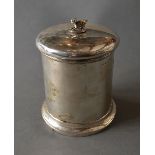 A London Silver Tobacco Box of Cylindrical Form, the cover with dog surmount, 13 cms tall,