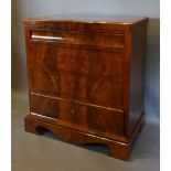 A 19th Century French Small Chest with a concealed frieze drawer above three further drawers raised