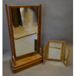 An Art Deco Oak Swing Frame Dressing Mirror with moulded base together with a triple folding