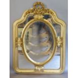 A Gilt Framed Sectional Wall Mirror with a pierced ribbon cresting and oval insert,