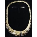 An 18ct. Gold Fringe Necklet set with four bands of diamonds, 45.