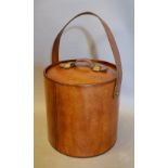 A Leather Travelling Wine Cooler of Circular Form with Tongs