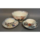 An 18th Century English Bowl together with two similar tea bowls and saucers