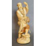 A 19th Century Japanese Carved Ivory Okimono in the form of a Fisherman,