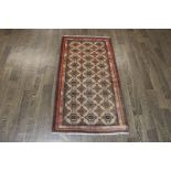 A North West Persian Woollen Rug with an all over design upon a blue,