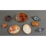 An Oval Cameo Brooch decorated in relief with Putti,