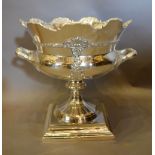 A Silver Plated Large Wine Cooler of Shaped Form with Side Handles raised upon square stepped base,