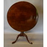 A George III Mahogany Centre Table with turned centre column and tripartite legs with pad feet,