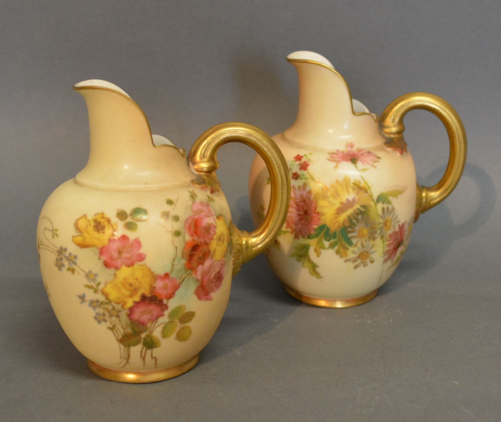 A Pair of Royal Worcester Blush Ivory Jug Vases each hand painted with summer flowers and