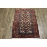 A North West Persian Woollen Rug with an all over design upon a blue,