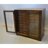 A 20th Century Hardwood Collectors' Cabinet,