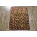 A North West Persian Woollen Rug with an all over design upon a red ground within multiple borders,