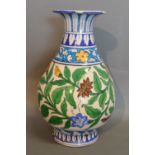 An Early Iznik Vase of Oviform with Polychrome Foliate Decoration,