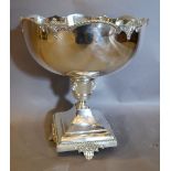 A Large Silver Plated Punch Bowl upon a Square Pedestal Base with Scroll Feet, 37 cms diameter,