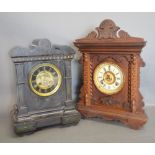 A Victorian Black Slate Mantle Clock with Two Train Movement,