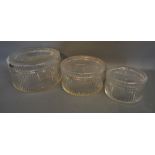 A Graduated Set of Three Cut Glass Cylindrical Covered Boxes,