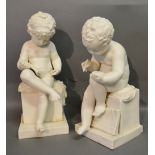 A Pair of Parian Ware Figures in the form of Putti 'Writing and Reading',