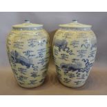 A Pair of Chinese Large Floor Standing Covered Vases, decorated in underglaze blue,