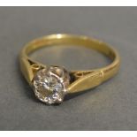 An 18ct Gold Solitaire Diamond Ring, the single diamond within a pierced setting, approximately 0.