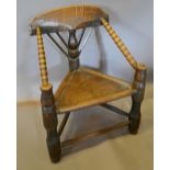 An Early 19th Century Oak Turners Chair with turned uprights and stretcher