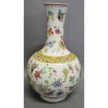 A Chinese Bottle Neck Vase decorated in Polychrome Enamels with Butterflies amongst Foliage,