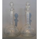 A Pair of Edwardian Cut Glass Decanters with Stoppers with foliate engraved decoration