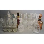 A Large Collection of Cut Glass Decanters with Stoppers,
