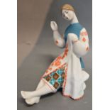 A Russian Porcelain Figure in the form of a Girl in Costume, numbered 97,
