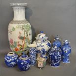 A Chinese Blue and White Bulbous Shaped Covered Vase decorated with figures within landscapes