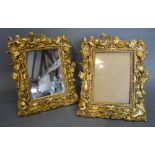 A Modern Gilt Plaster Table Mirror, together with a matching photograph frame mounted with putti,