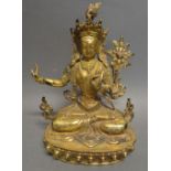 A Chinese Gilt Bronze Model in the Form of a Seated Diety,