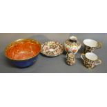 A Wedgwood Lustre Small Bowl with Gilt Decoration upon a mottled blue and orange ground,