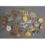 A Collection of Military Cap Badges and Buttons