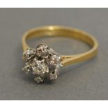 An 18ct. Yellow Gold Diamond Cluster Rin