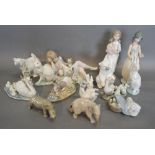 A Lladro Porcelain Model of a Polar Bear together with a large collection of Lladro figures and