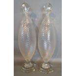 A Pair of Glass Large Covered Vases of Gherkin Cut Form with hexagonal stepped bases,