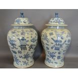 A Pair of Chinese Underglaze Blue Decorated Large Covered Vases,