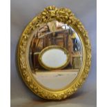 An Oval Gilded Wall Mirror with Ribbon B