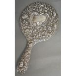 A Sterling Silver Hand Mirror with heavi