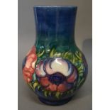 A Moorcroft Anemone Tube Lined Squat Vase with green and blue ground, 17.