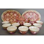 A Chinese Porcelain Service comprising nine tea bowls, a pair of oval platters, pot and covered cup,