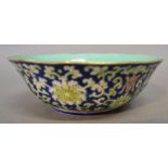 A 19th Century Chinese Porcelain Bowl with a foliate decoration upon a blue ground,