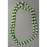 A Cultured Pearl and Green Hard Stone Be