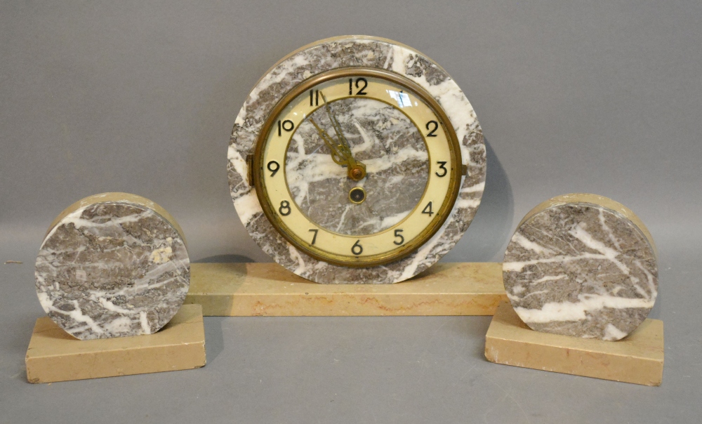 An Art Deco Marble Clock Garniture of Cy