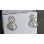 A Pair of 18ct. White Gold Pearl and Dia