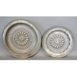 An 18th Century German Pewter Alms Dish, 42 cms diameter, together with another similar alms dish,