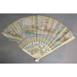 An 18th Century Ivory Fan, the sticks inlaid with mother of pearl and highlighted with gilt,