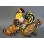 A Wedgwood Model in the form of a Cockerel together with a pair of continental porcelain figures of